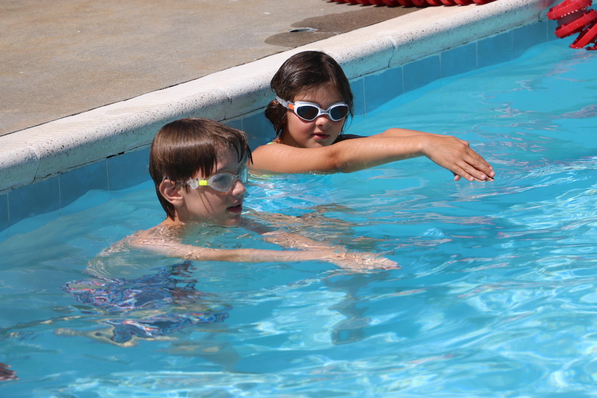Two students learning to swim.