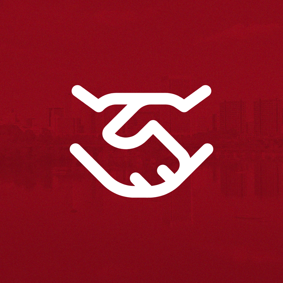 a red square with two hands shaking in agreement