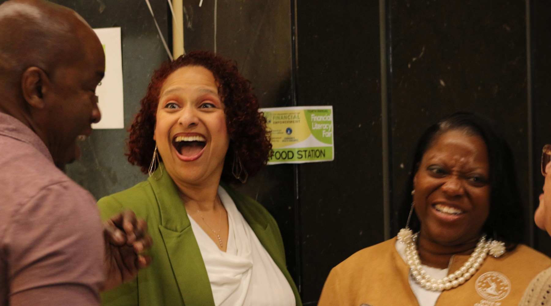 Treasurer Nichole Armstead laughs with colleagues.