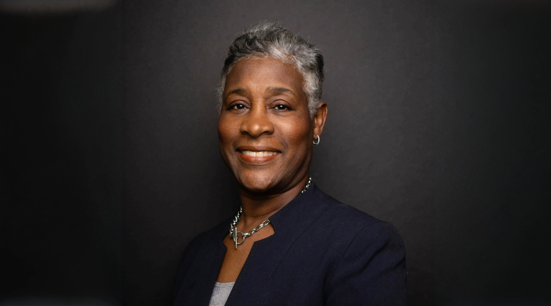 Commonwealth's Attorney Colette McEachin in a dark jacket in front of a dark background.