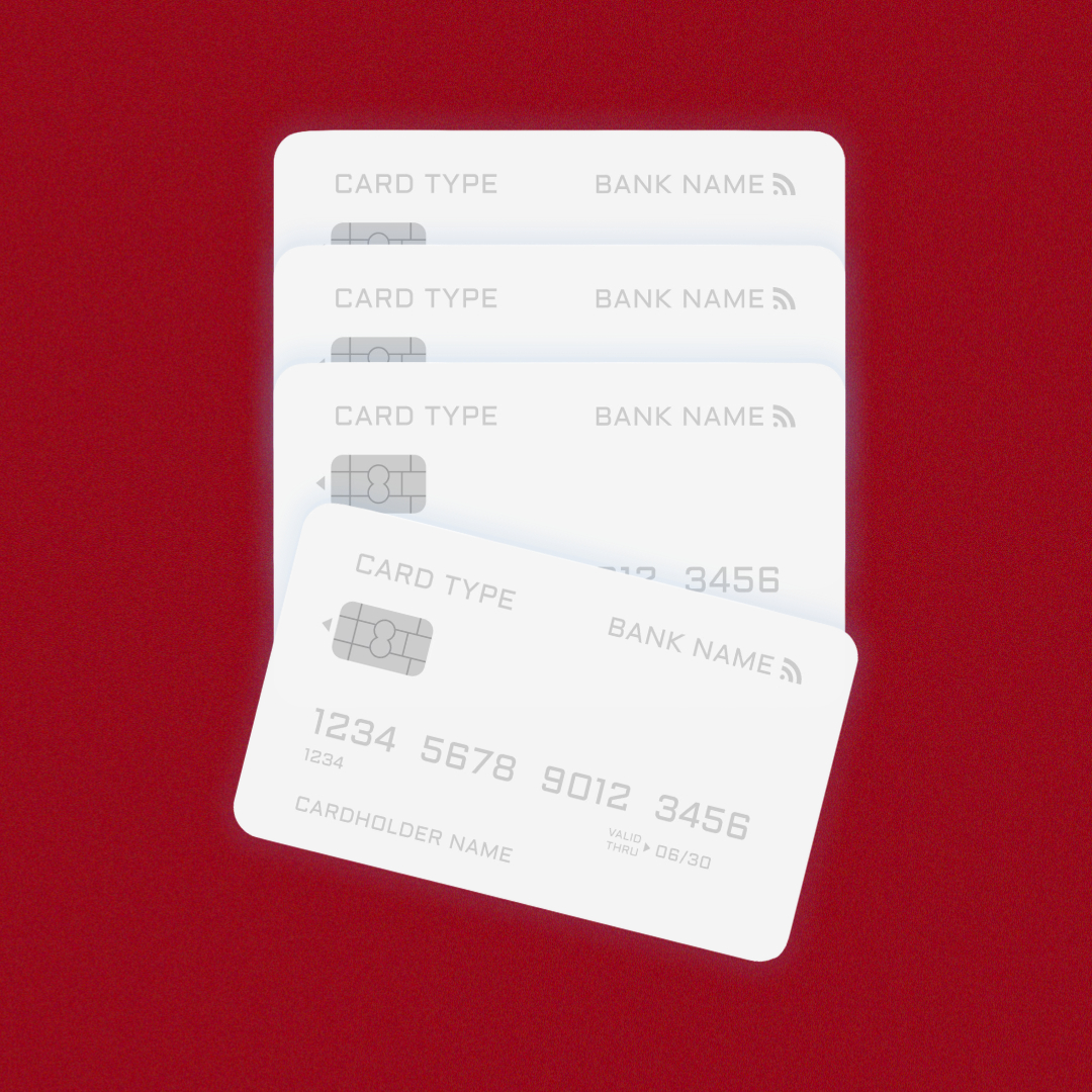 An image of multiple credit cards on a red background