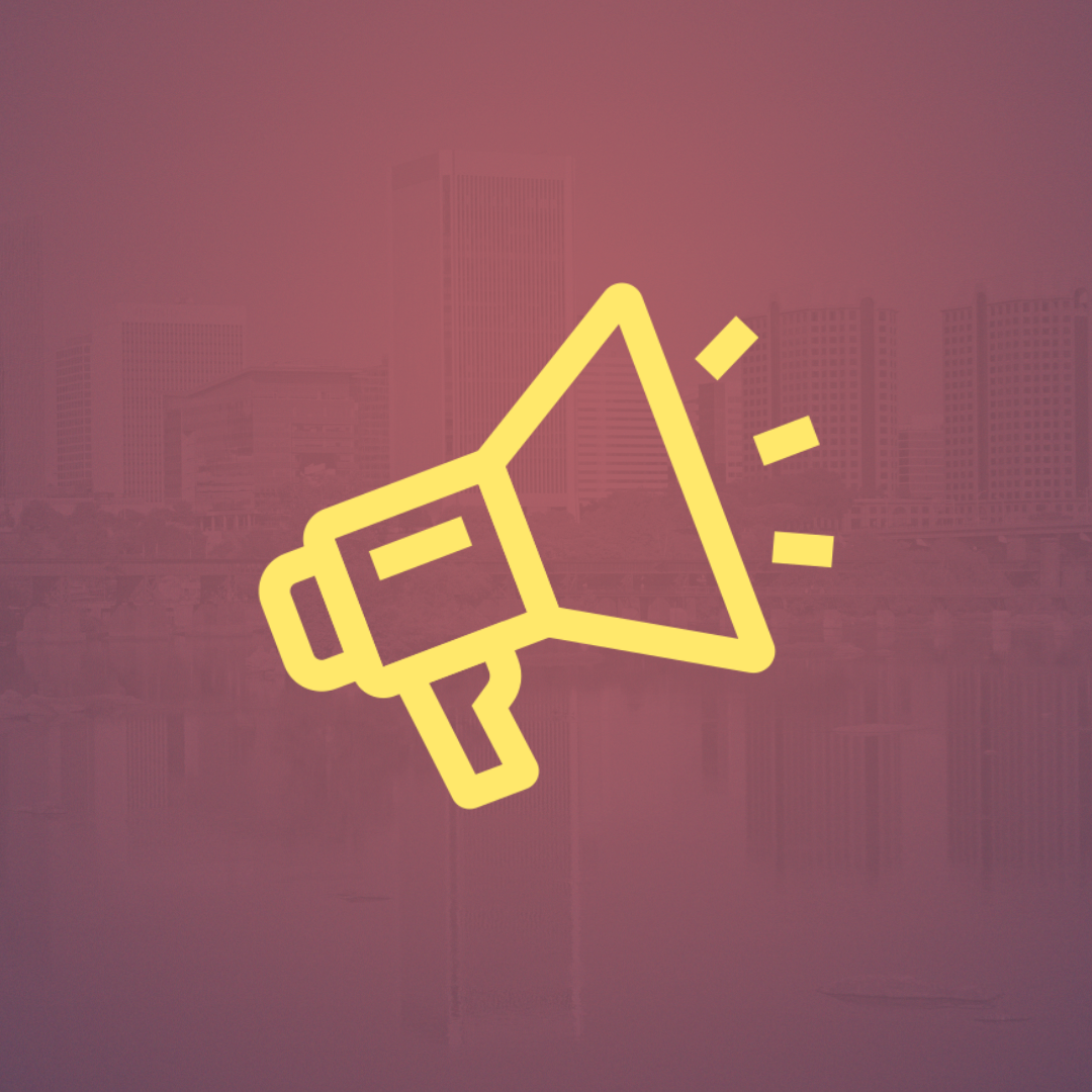A yellow megaphone icon on a red background