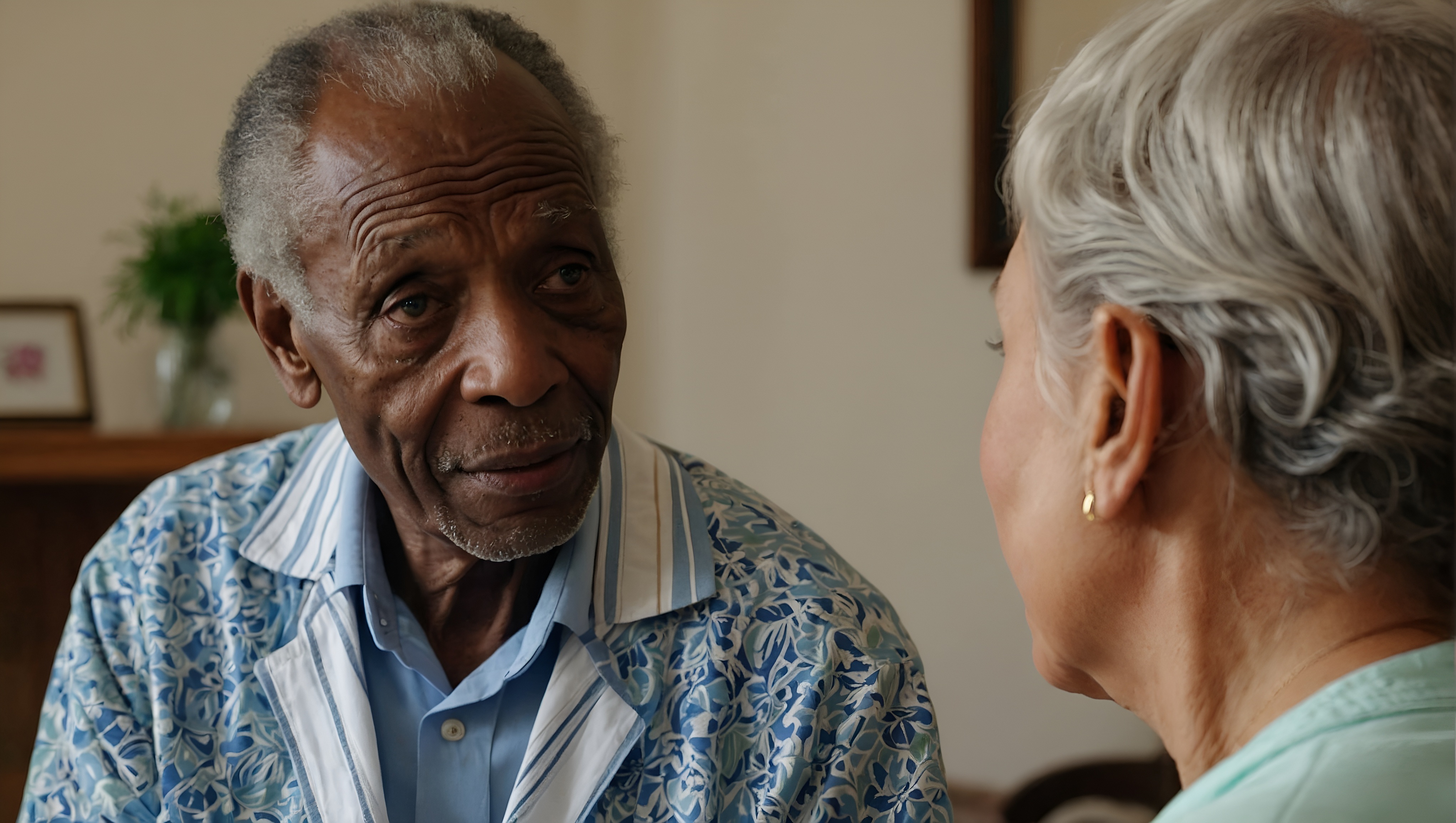 Older adult man looking at female partner.